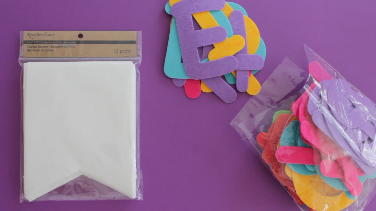 Materials for DIY Eid garland include store bought stickers and a banner.