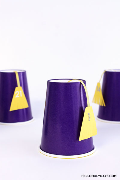 3 upside down cups are used to make a Ramadan Drummer's hat calendar.