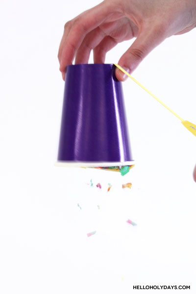 A paper cup is transformed into a pinata.