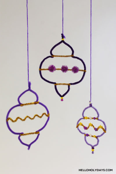 Ramadan lanterns made of pipe cleaners hang decoratively.