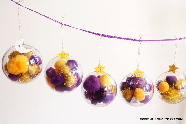 Ornaments are displayed hanging from a ribbon for Ramadan.