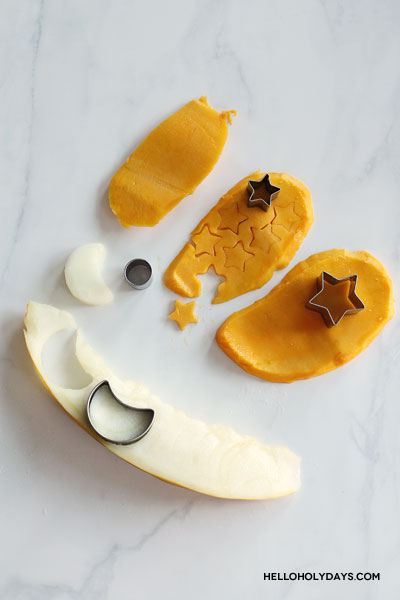 Cookie cutter cut star and moon shaped fruit for Ramadan yogurt bark recipe.