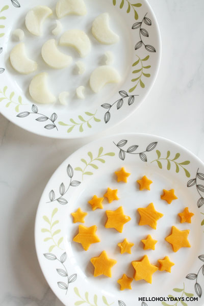 Moon and star shaped fruit is displayed on a plate for a Ramadan recipe.