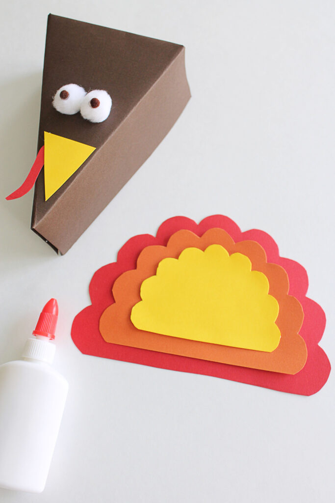 Stack the feathers to resemble a turkey bird.